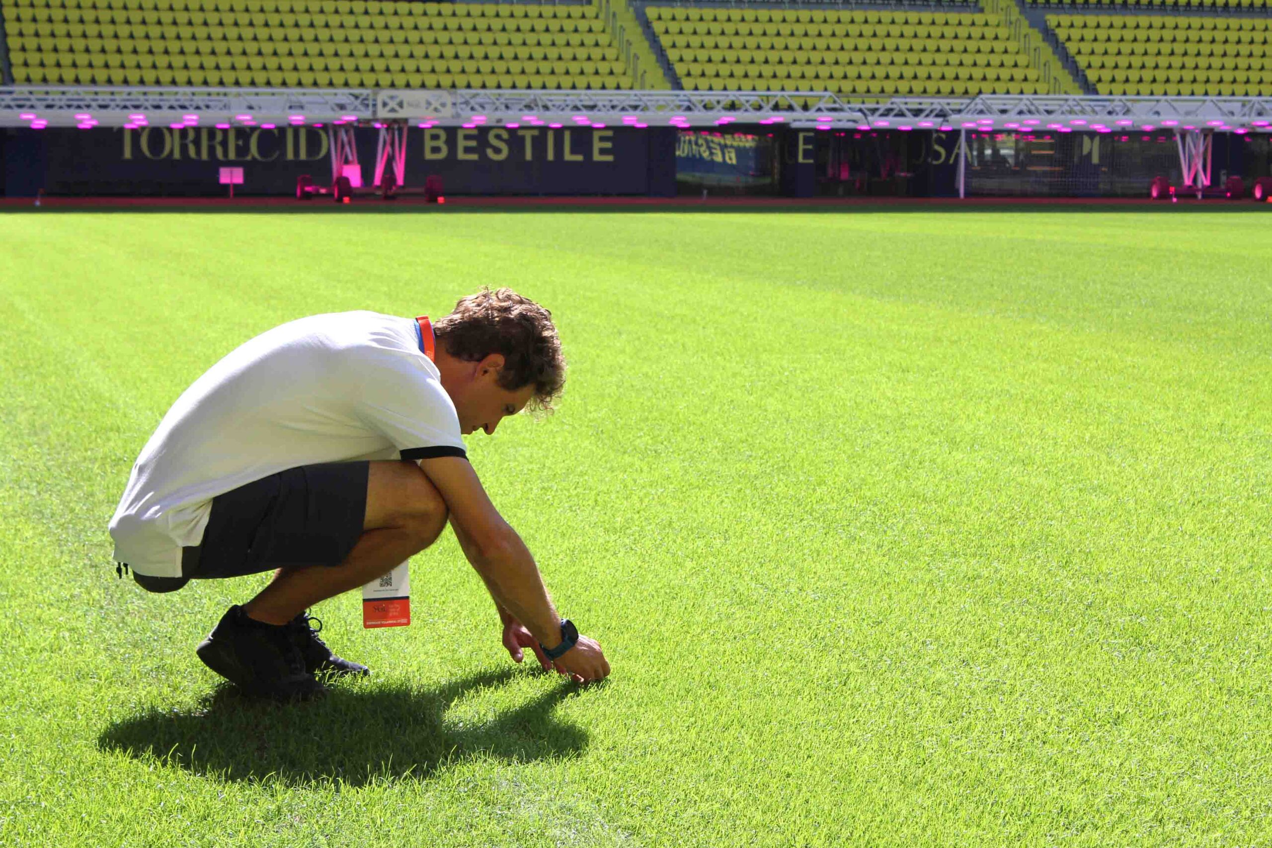 Groundsman checks the grass of the Villarreal CF pitch.